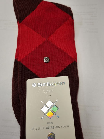 A single folded Burlington Clyde men's sock with an argyle pattern in red and dark brown, featuring a small silver button and a paper tag attached.